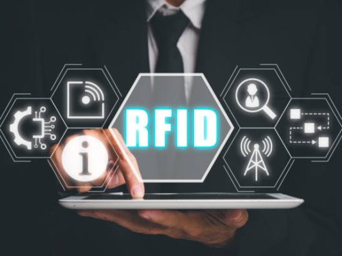 RFID, Radio frequency identification concept, Person using digital tablet and hand touching RFID icon on virtual screen.